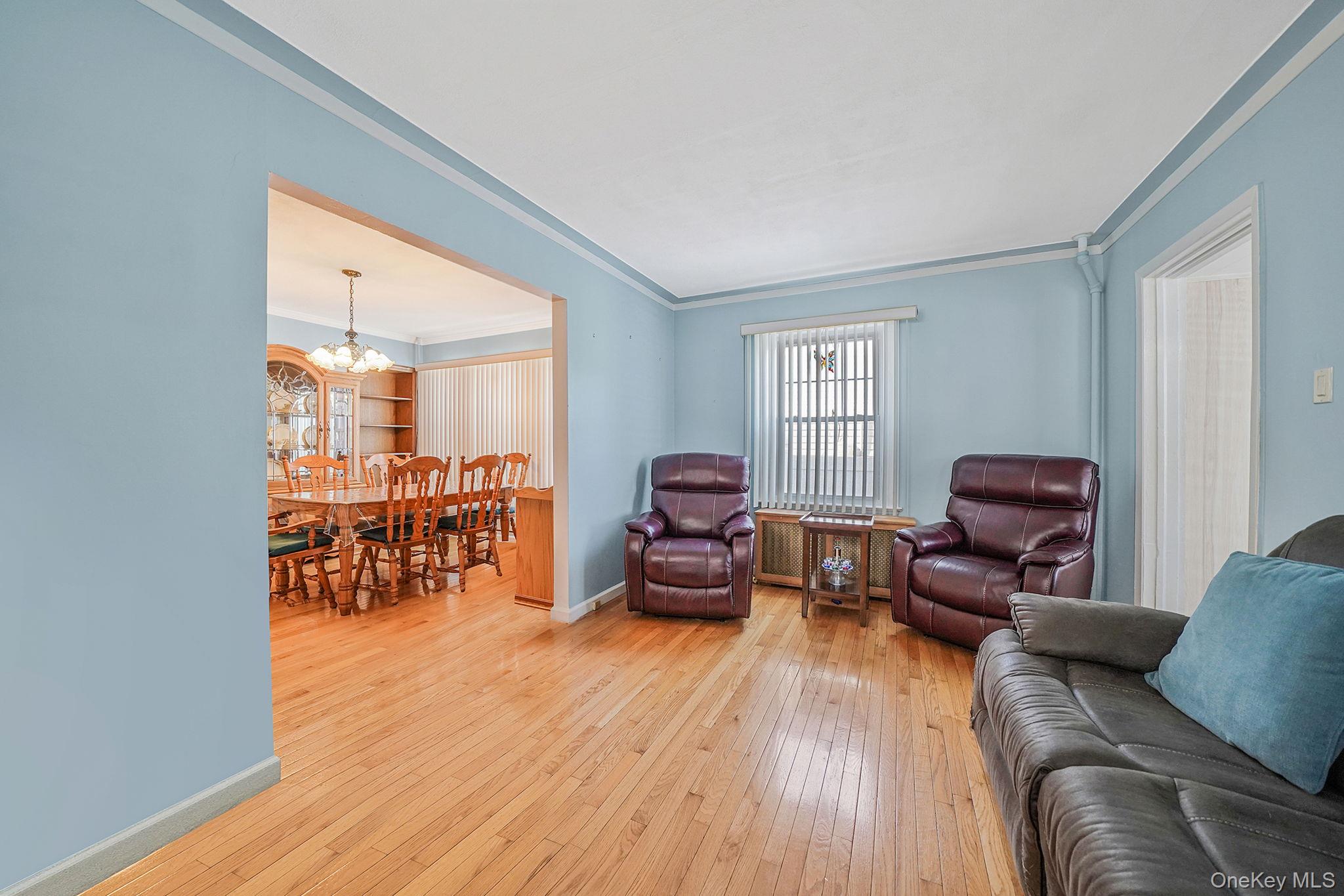 256-12 87th Road Floral Park, NY 11001 - Photo 7 of 33 a living room with furniture and a wooden floor