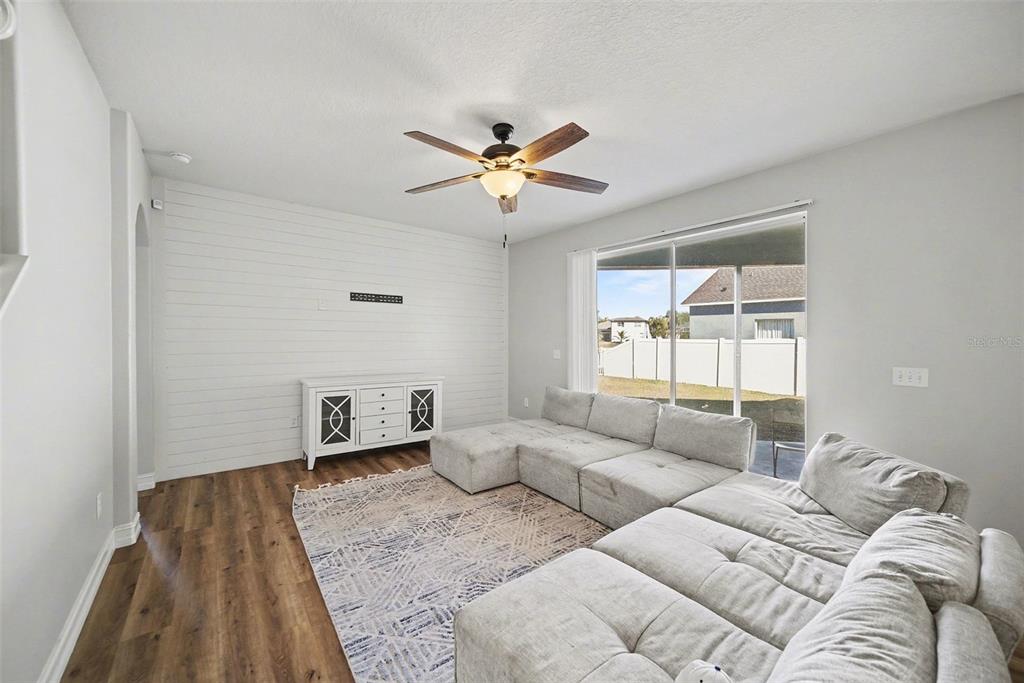4809 Walnut Ridge Road Land O' Lakes, FL 34638 - Photo 11 of 34 a living room with furniture and a window