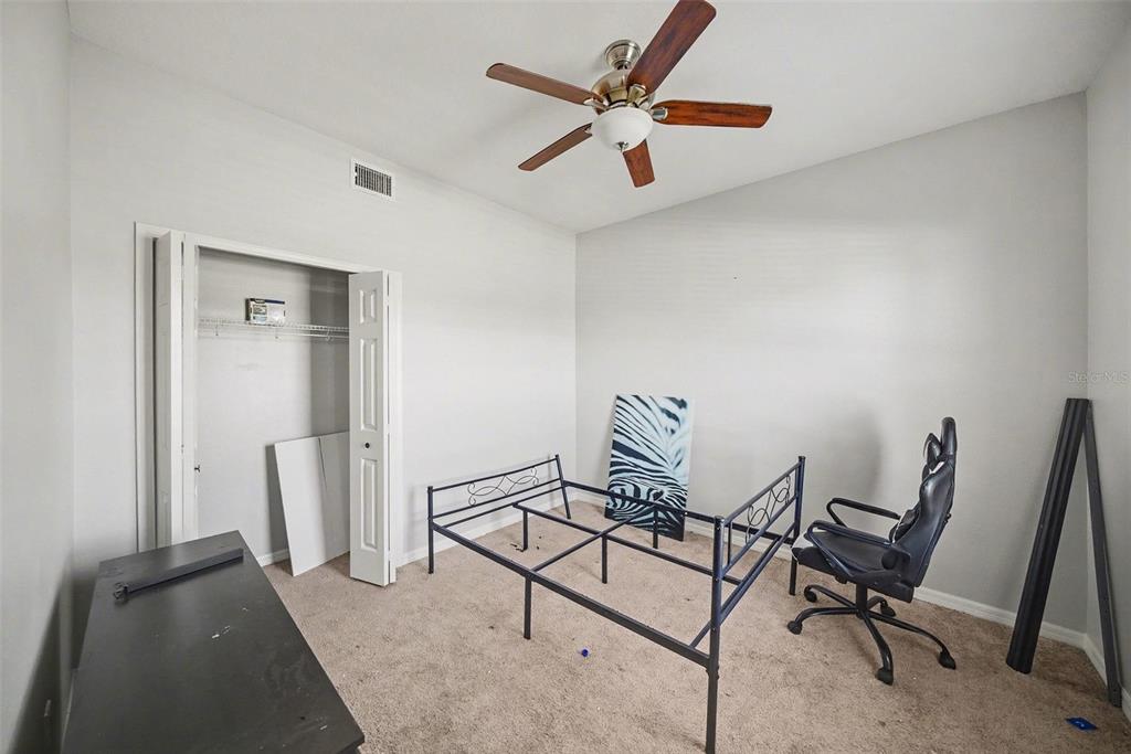 4809 Walnut Ridge Road Land O' Lakes, FL 34638 - Photo 15 of 34 a view of a livingroom with furniture and a ceiling fan