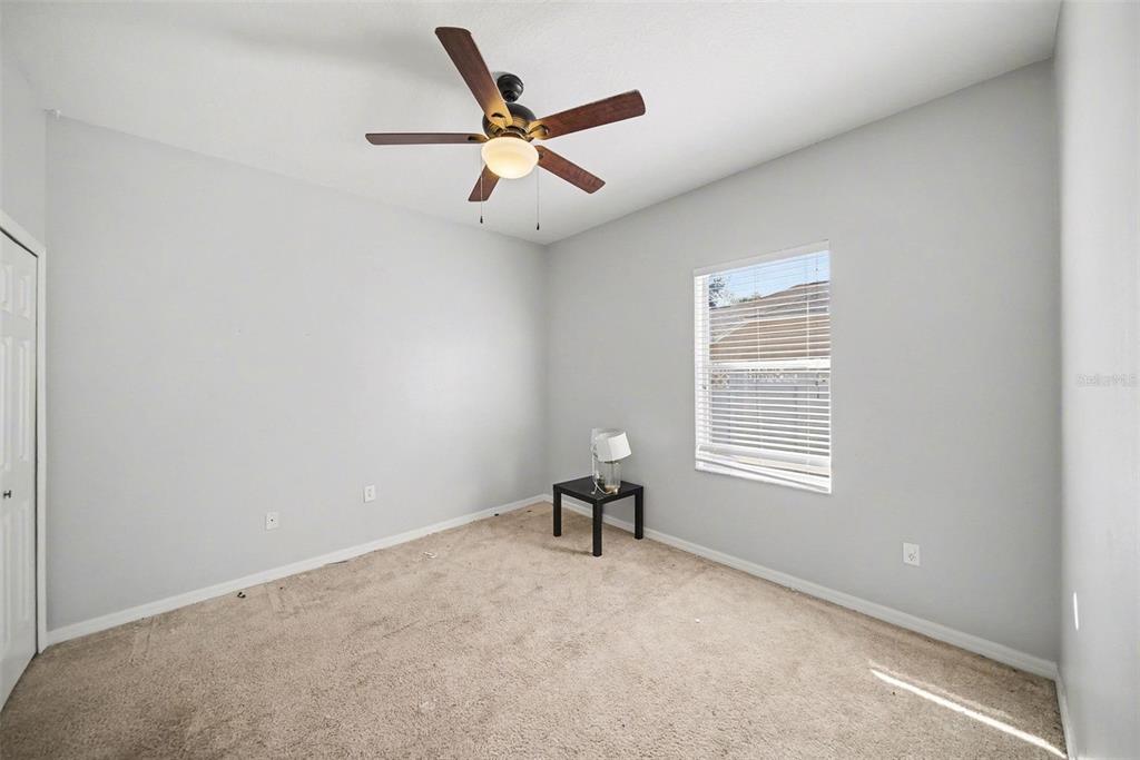 4809 Walnut Ridge Road Land O' Lakes, FL 34638 - Photo 17 of 34 a view of a livingroom with a ceiling fan and a window