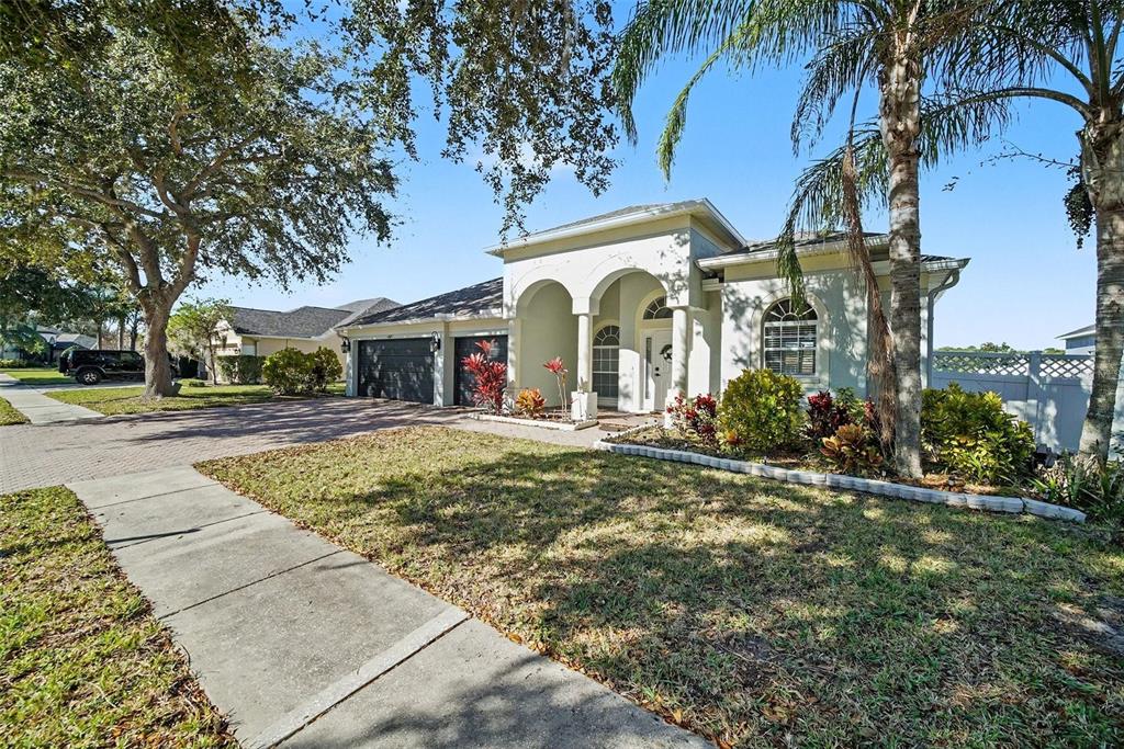 4809 Walnut Ridge Road Land O' Lakes, FL 34638 - Photo 34 of 34 a front view of a house with garden