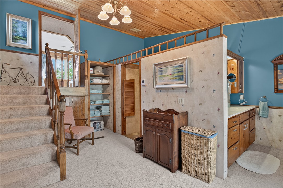 351 River Road Westminster, SC 29693 - Photo 27 of 50 Natural wood ceilings and a split-level design create a cozy, multi-functional bathroom space.