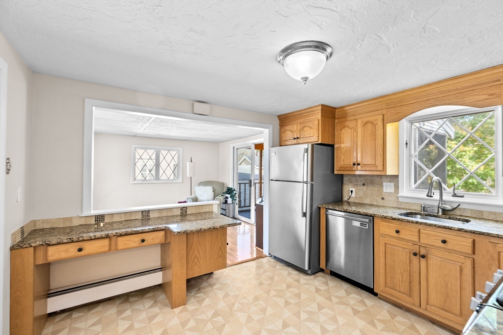 35 Red Jacket Road Weymouth, MA 02190 - Photo 11 of 33 a kitchen with a refrigerator and a sink