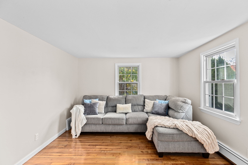 35 Red Jacket Road Weymouth, MA 02190 - Photo 18 of 33 a living room with furniture and a window