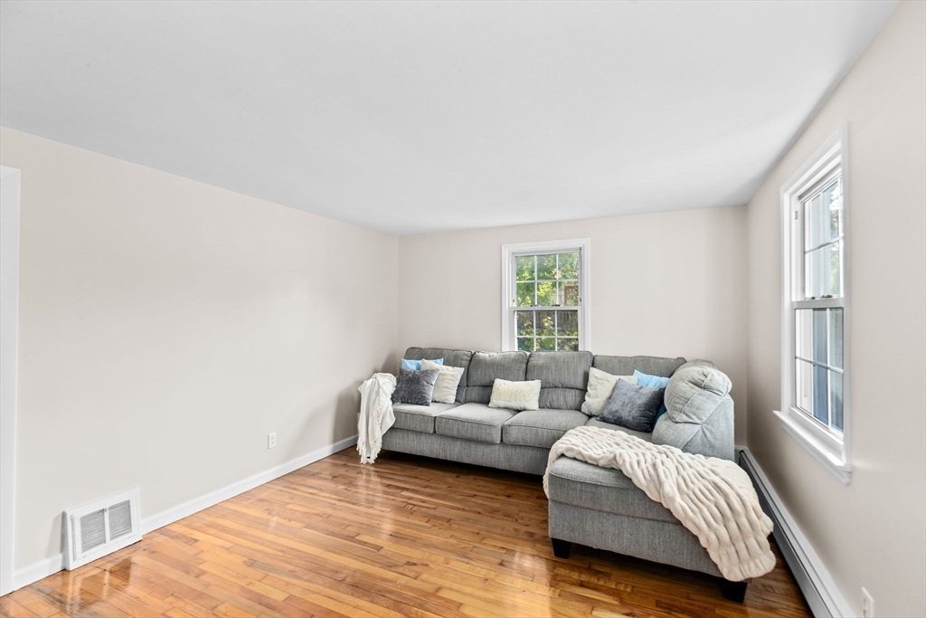 35 Red Jacket Road Weymouth, MA 02190 - Photo 19 of 33 a living room with furniture and a window