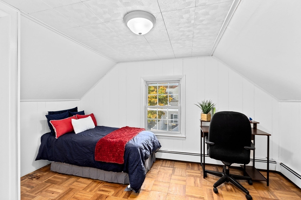 35 Red Jacket Road Weymouth, MA 02190 - Photo 22 of 33 a bedroom with a bed and a chair