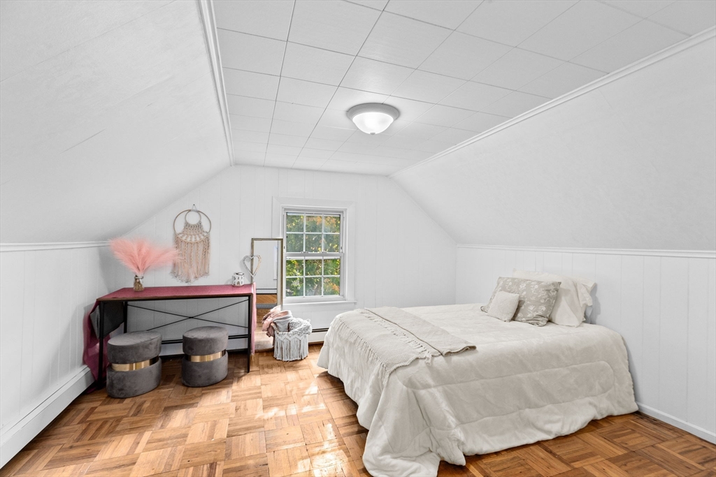 35 Red Jacket Road Weymouth, MA 02190 - Photo 25 of 33 a bedroom with a bed a chandelier and a large window