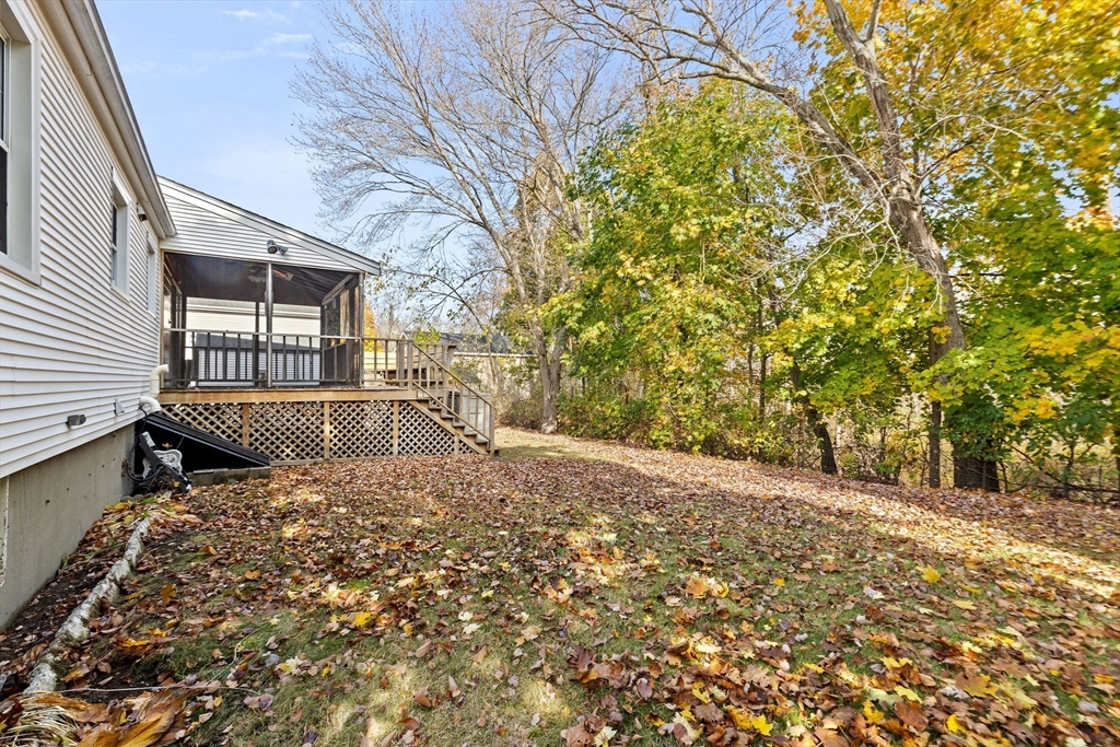 35 Red Jacket Road Weymouth, MA 02190 - Photo 33 of 33 a view of a backyard with a tree