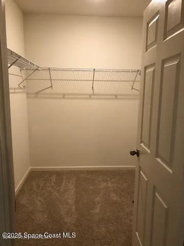 a room with a bed and a window