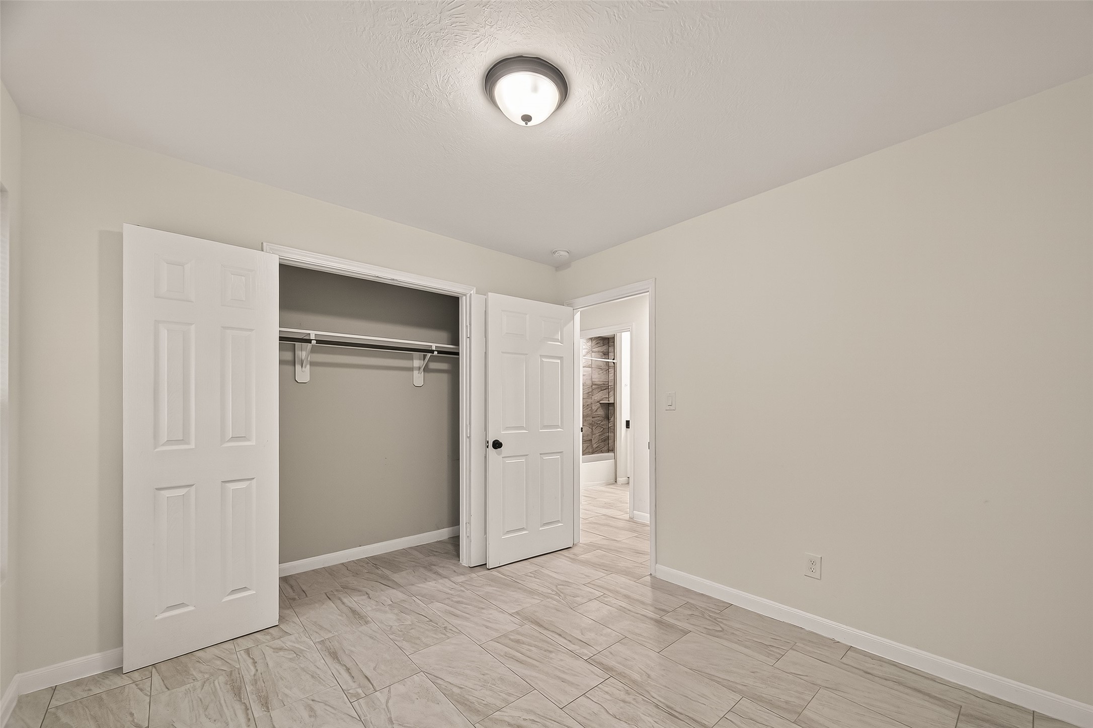 4302 Hirsch Road, Unit B Houston, TX 77026 - Photo 21 of 30 an empty room with closet area and mirrors