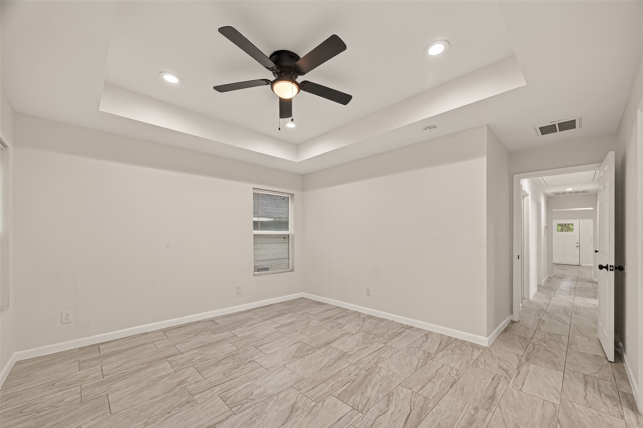 4302 Hirsch Road, Unit B Houston, TX 77026 - Photo 22 of 30 an empty room with wooden floor and windows