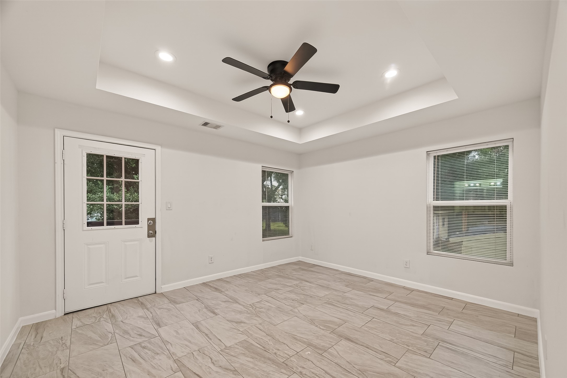 4302 Hirsch Road, Unit B Houston, TX 77026 - Photo 23 of 30 a view of an empty room with a window and wooden floor