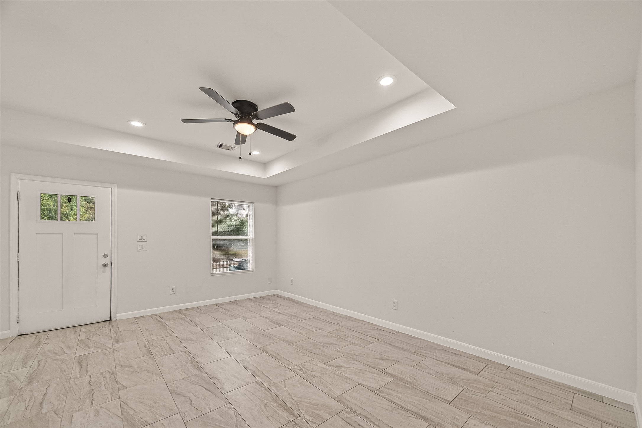 4302 Hirsch Road, Unit B Houston, TX 77026 - Photo 5 of 30 wooden floor in an empty room with a window