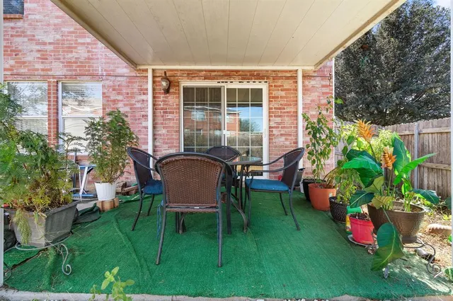a backyard of a house with outdoor seating