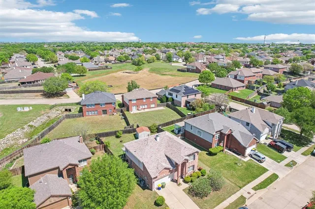 an aerial view of a house with a ocean view