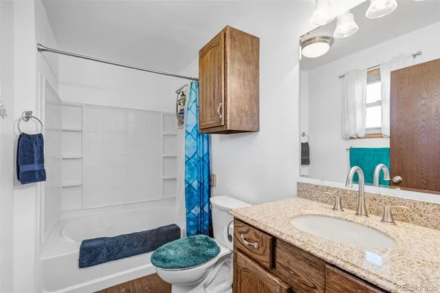 a view of a house with backyard porch and sitting area