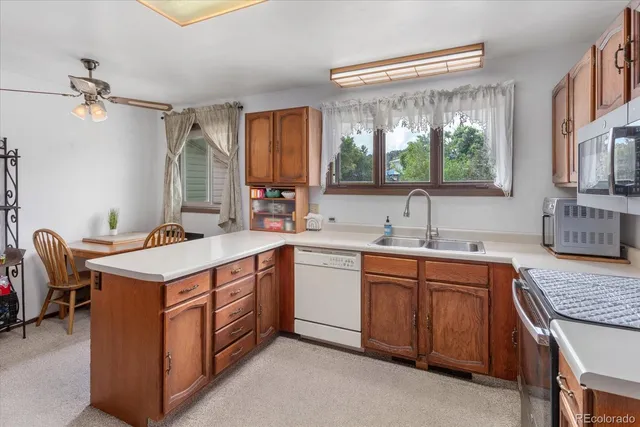 a kitchen with a stove top oven sink and cabinets