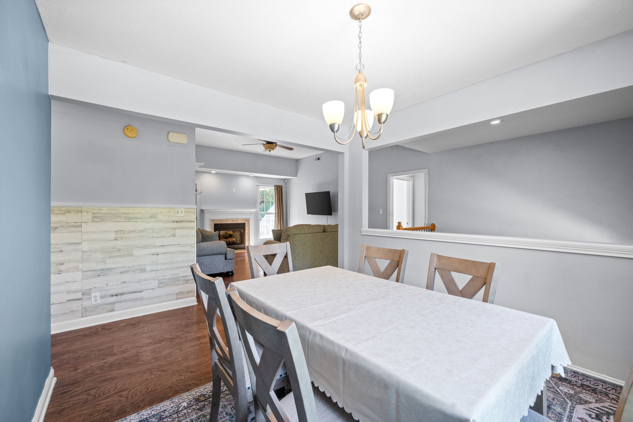 1148 York Meadows Road Clarksville, TN 37042 - Photo 12 of 35 a view of a dining room with furniture a chandelier and wooden floor