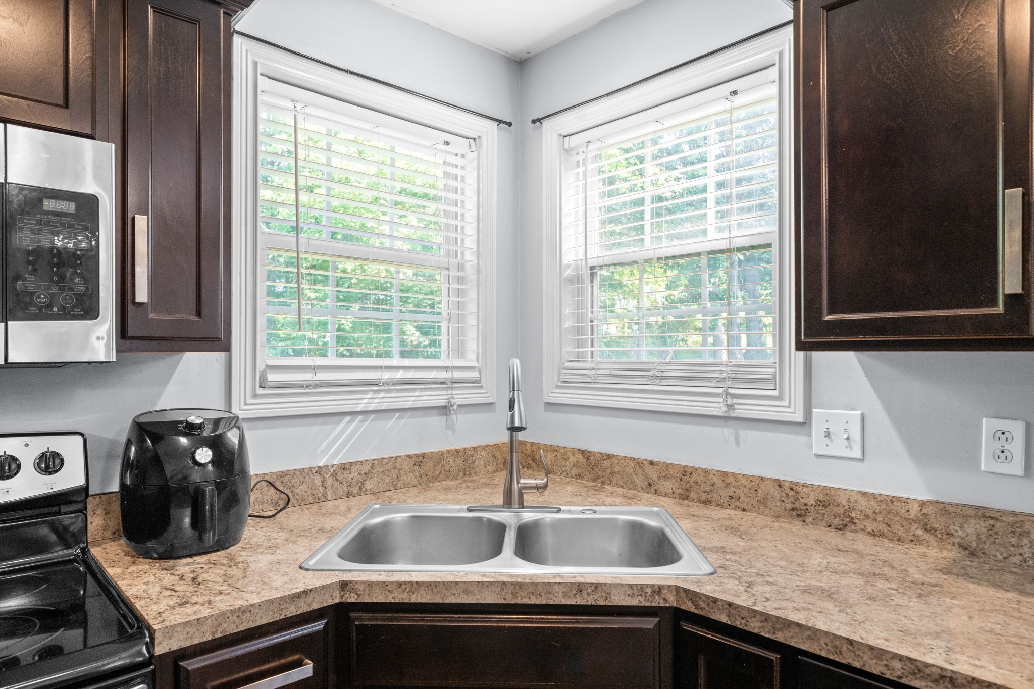 1148 York Meadows Road Clarksville, TN 37042 - Photo 14 of 35 a kitchen with granite countertop a sink and a window