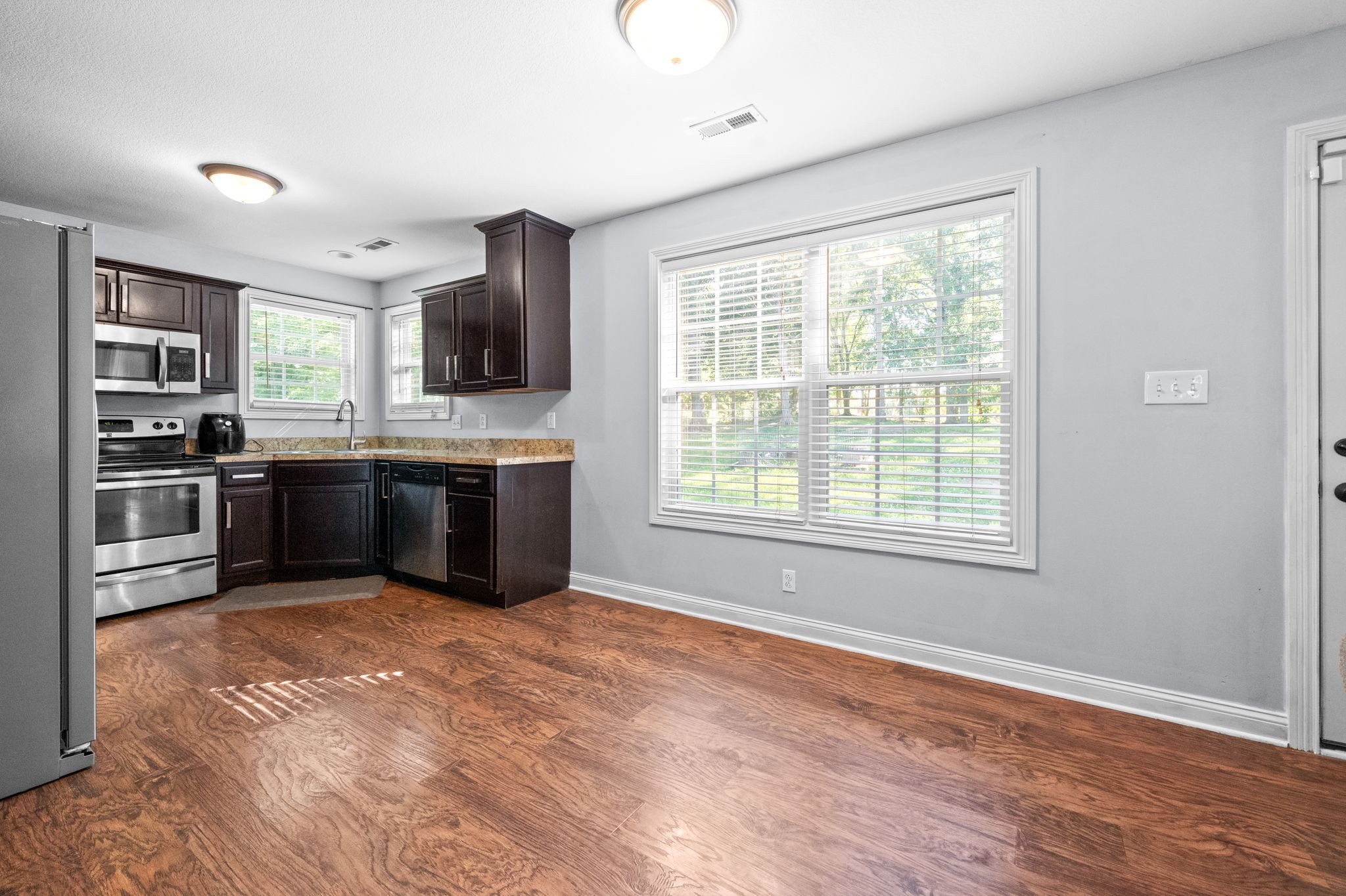 1148 York Meadows Road Clarksville, TN 37042 - Photo 16 of 35 a view of kitchen with kitchen island microwave and stove top oven