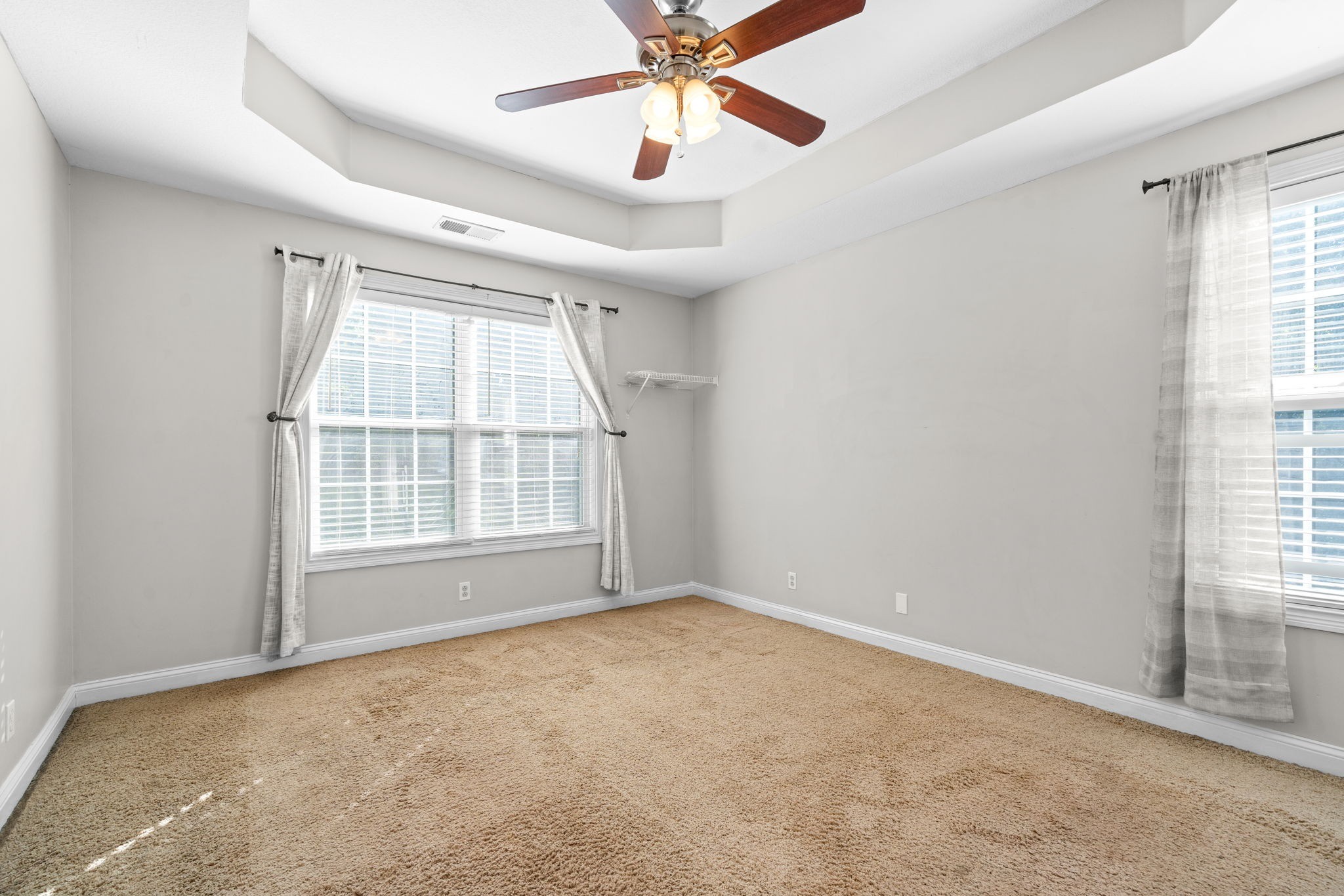 1148 York Meadows Road Clarksville, TN 37042 - Photo 17 of 35 an empty room with chandelier fan and windows
