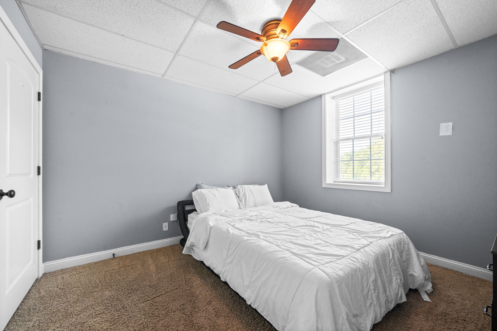 1148 York Meadows Road Clarksville, TN 37042 - Photo 26 of 35 a bedroom with a bed and a chandelier