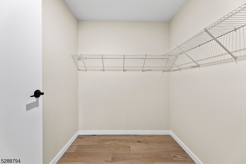 172 6th Street, Unit 54 Passaic, NJ 07055 - Photo 10 of 13 a view of a room with racks on the wall