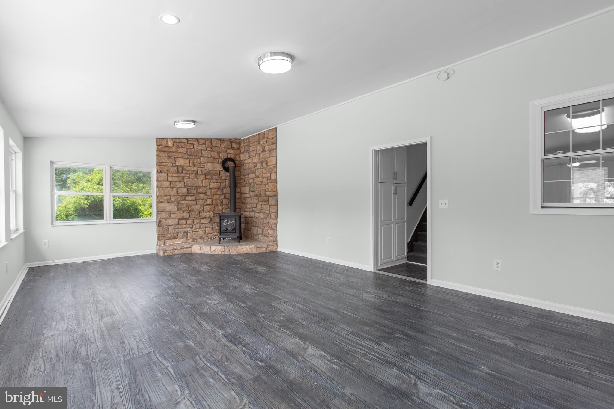 10827 Catharpin Road Spotsylvania, VA 22553 - Photo 12 of 39 an empty room with wooden floor and windows