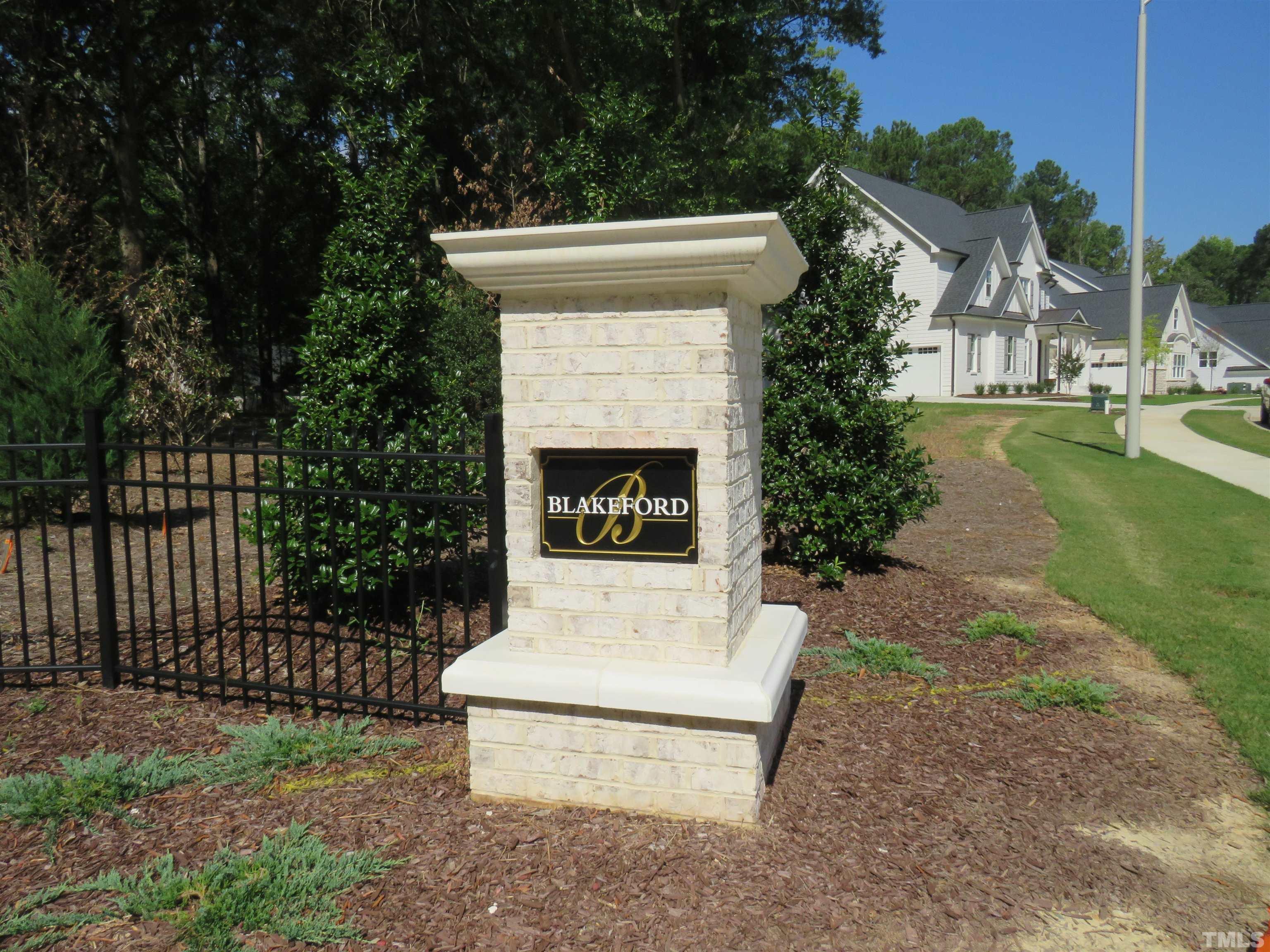 front view of a house with a garden