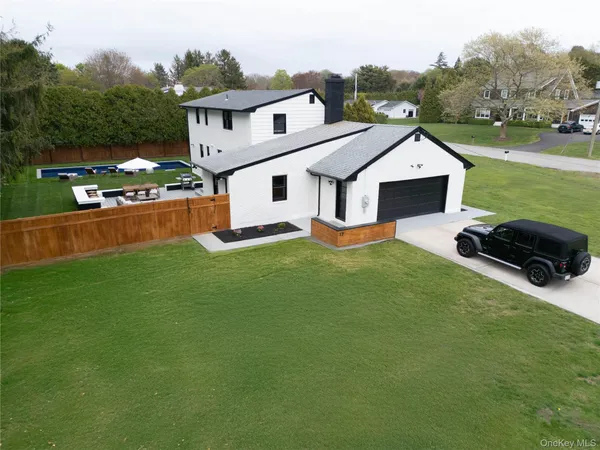 an aerial view of a house with a garden