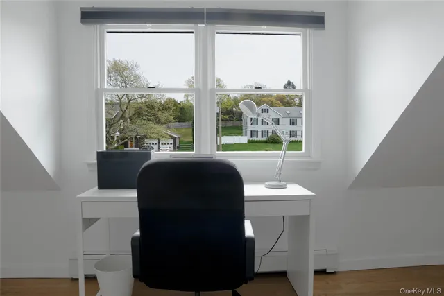 a room with a window and a chair