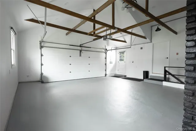 a view of a room with lots of wooden furniture