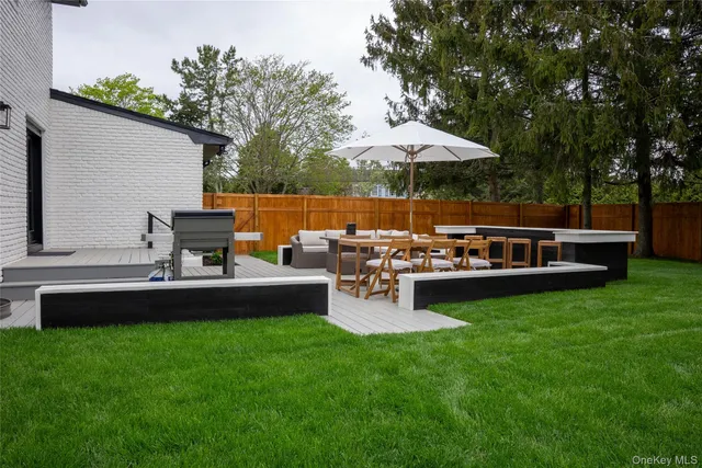a view of yard with seating area and green space