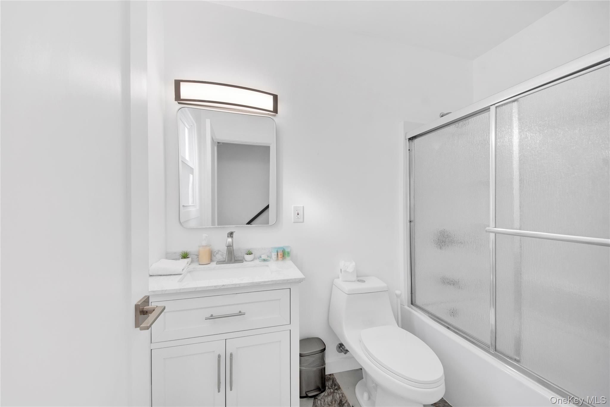 350 Old Post Road Marlboro, NY 12542 - Photo 19 of 36 a bathroom with a sink a toilet and shower