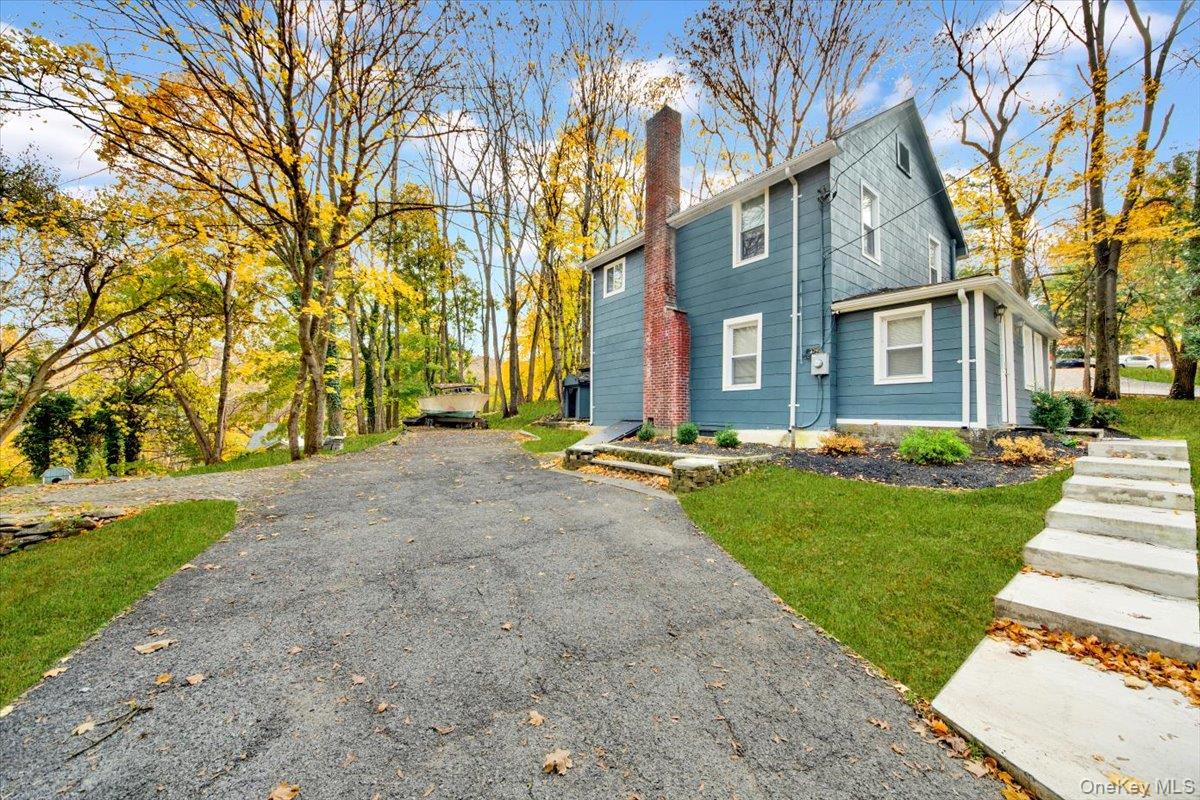 350 Old Post Road Marlboro, NY 12542 - Photo 22 of 36 a front view of a house with a yard and trees