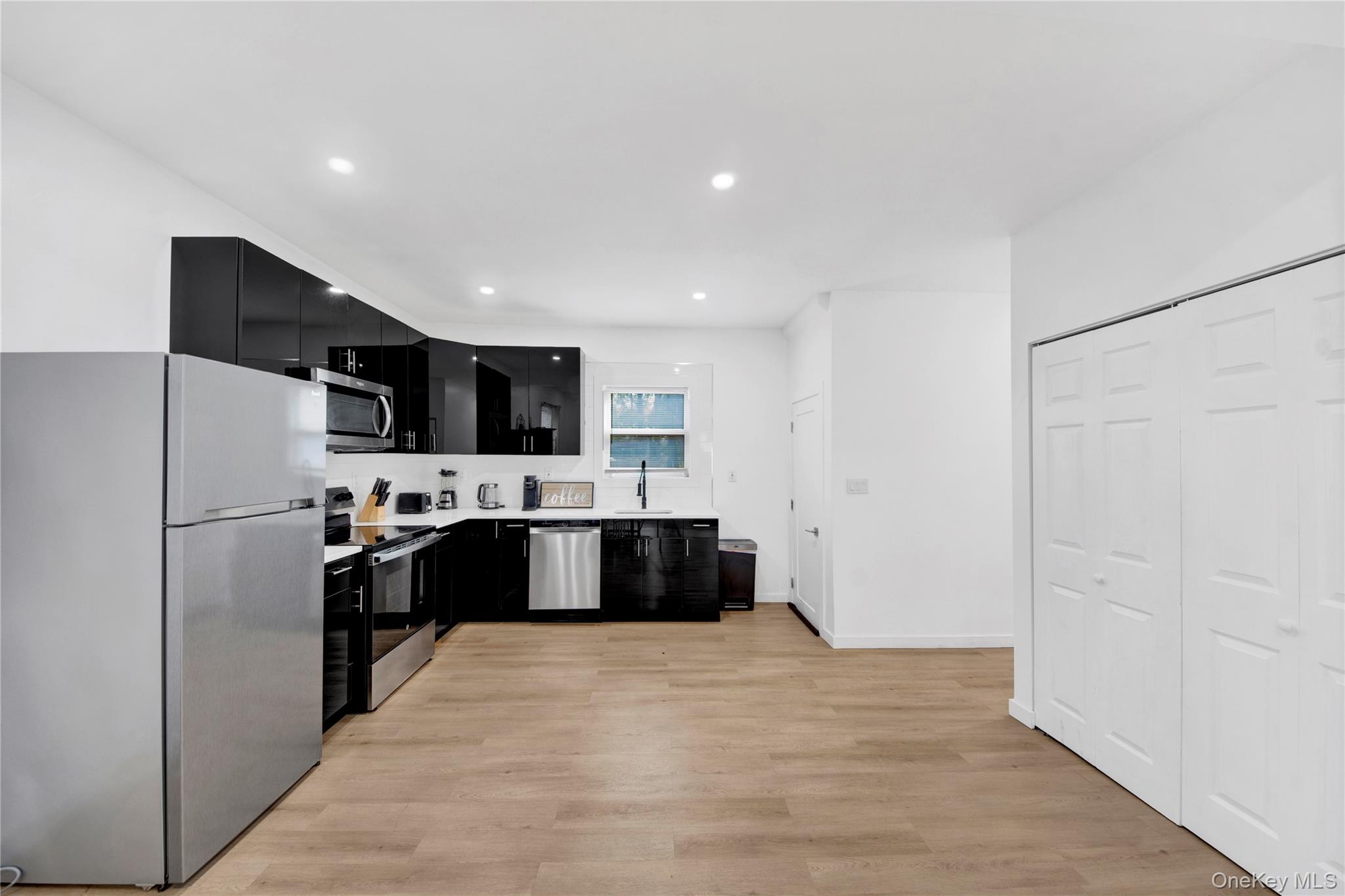 350 Old Post Road Marlboro, NY 12542 - Photo 3 of 36 a large white kitchen with a refrigerator and a sink