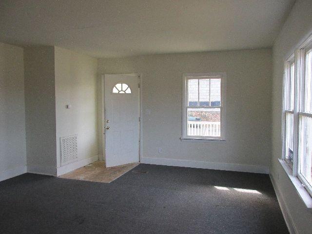 318 Connell Street Springfield, TN 37172 - Photo 4 of 20 Living Room has lots of windows. This view shows entry door.