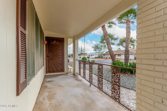 a view of balcony with wooden floor