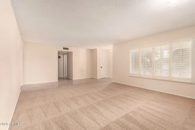 a view of an empty room with a window