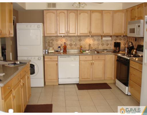 36 Crescent Road Edison, NJ 08817 - Photo 3 of 7 a kitchen with stainless steel appliances granite countertop a stove a sink and a refrigerator