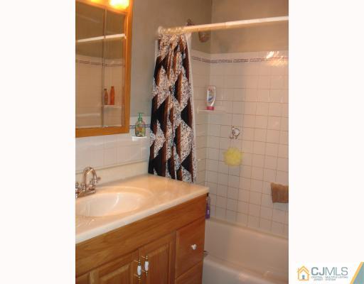 36 Crescent Road Edison, NJ 08817 - Photo 5 of 7 a bathroom with a sink and a shower