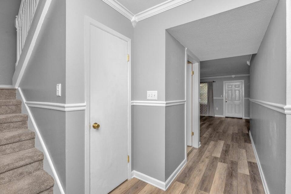 1037 4th Avenue Shalimar, FL 32579 - Photo 3 of 22 a view of a hallway with wooden floor and entryway