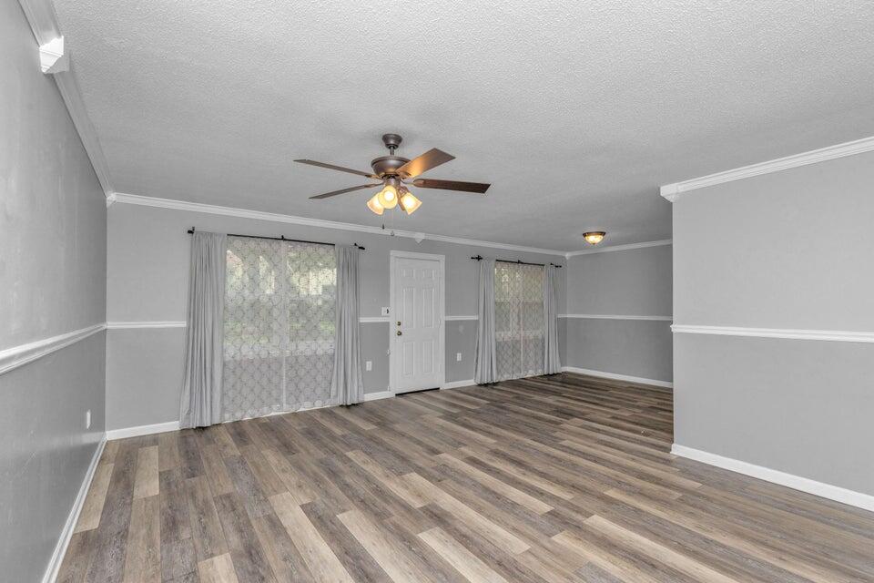 1037 4th Avenue Shalimar, FL 32579 - Photo 5 of 22 wooden floor in an empty room with a window