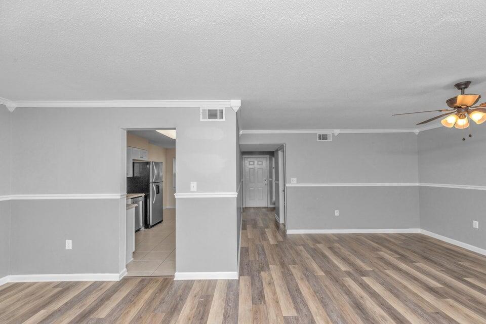 1037 4th Avenue Shalimar, FL 32579 - Photo 6 of 22 a view of empty room with wooden floor and windows