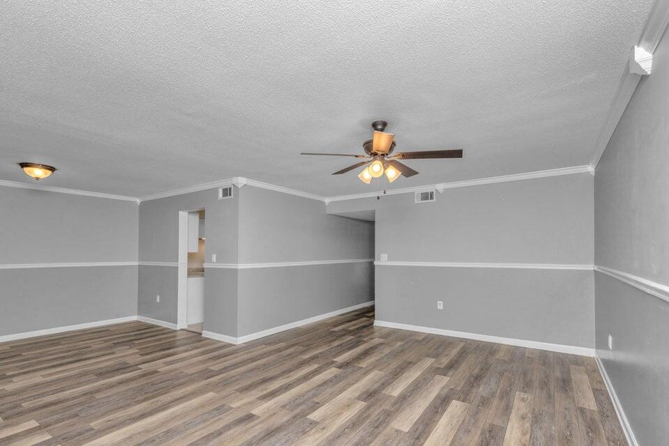 1037 4th Avenue Shalimar, FL 32579 - Photo 7 of 22 a view of an empty room with a window and wooden floor