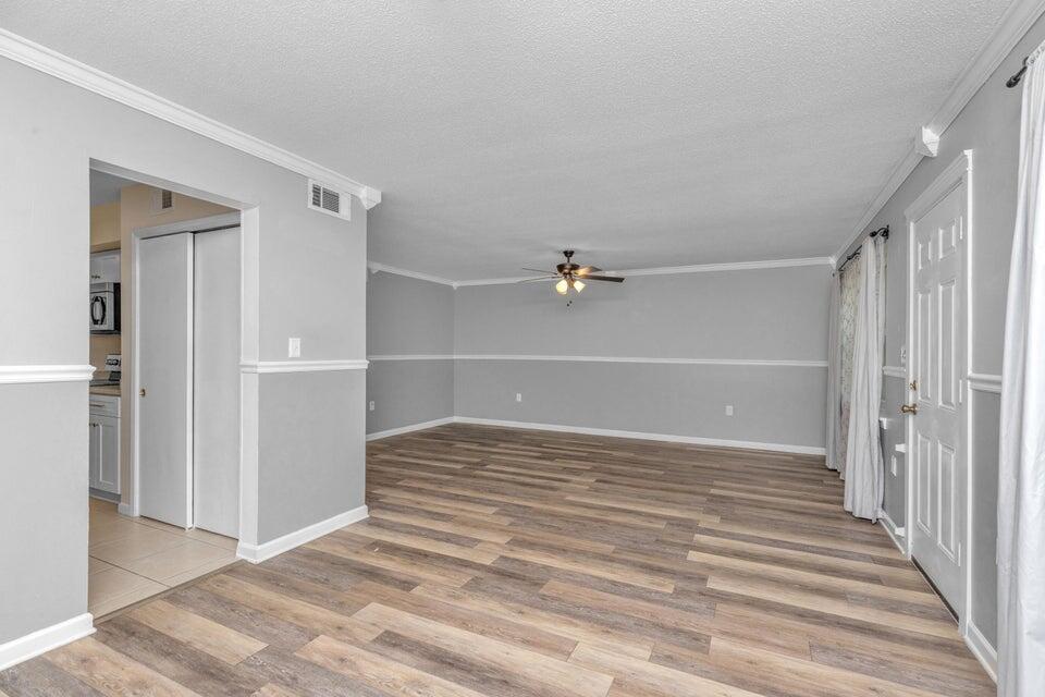 1037 4th Avenue Shalimar, FL 32579 - Photo 8 of 22 a view of a room with wooden floor and closet