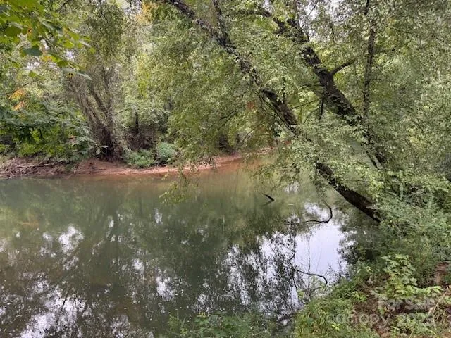 a view of lake with green space