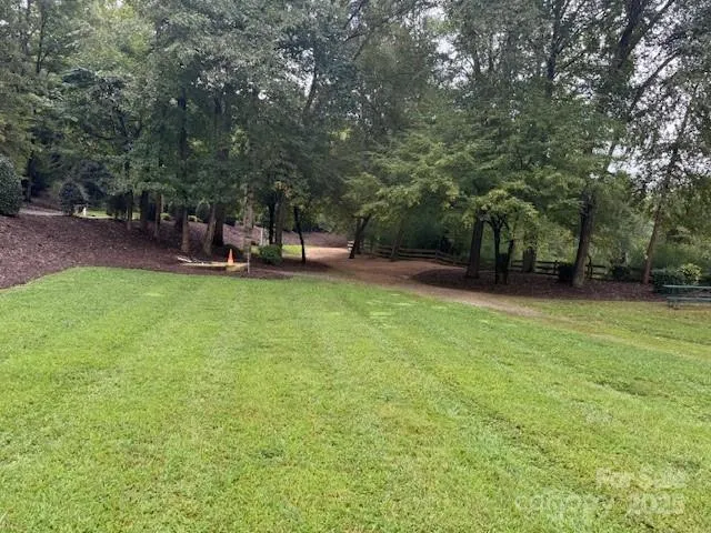 a sign that is sitting on a rock