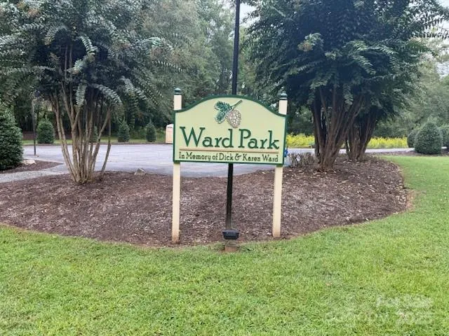 a view of an outdoor space with trees all around