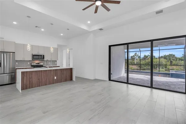 a kitchen with a sink and a refrigerator